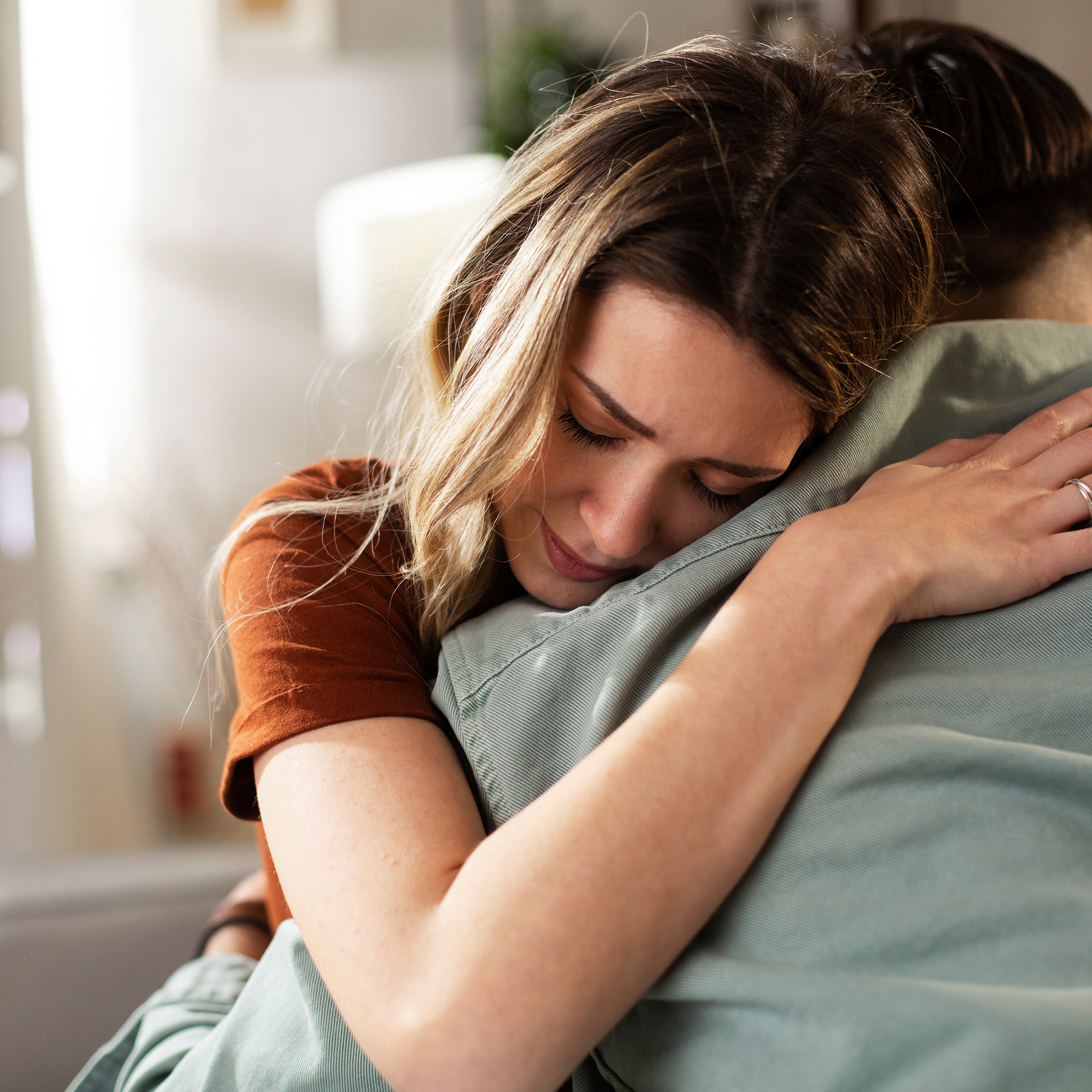 Woman Comforts Husband